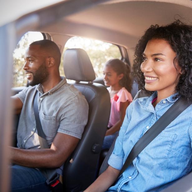 Happy family inside a car